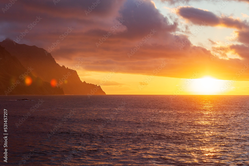 Sunset seascape at cliff shore of north of Tenerife island. Spain