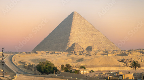 A view of the huge pyramid of Cheops, Giza, Egypt at sunrise.	