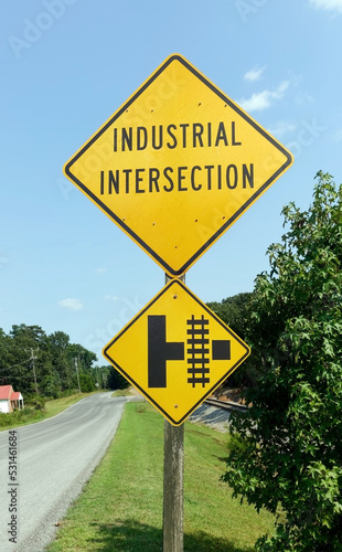 Industrial Intersection road sign in rural Virginia. Blue sky and county road.