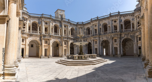 View at the Renaissance main cloister, with ornamented fountain in the middle, an iconic piece of the Portuguese renaissance type, on Convent of Christ, Tomar