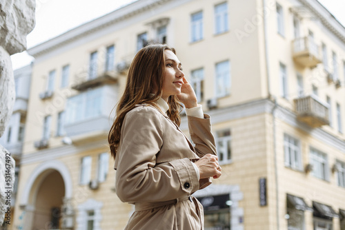 A couple in love walks in the autumn city in light clothes