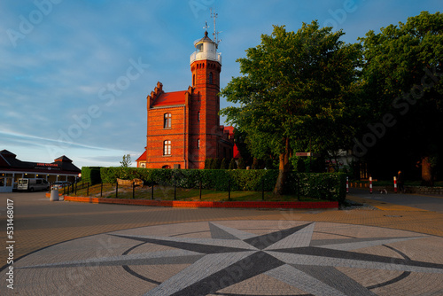 2022-06-02 square in front of baltic sea lighthouse in ustka town on the sunset. ustka, poland photo