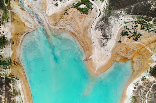 Drone point of view Embalse de La Pedrera large turquoise colored lake used as source of water supply, no people, sunny summer day, bright colors. Orihuela, Costa Blanca, Spain photo