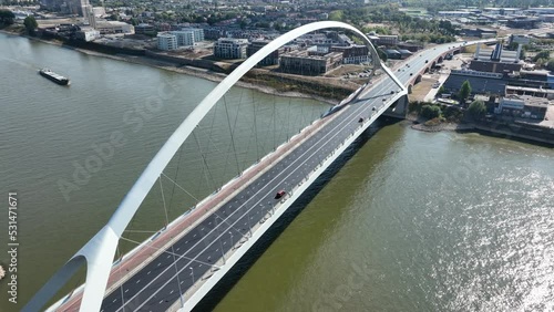 De Oversteek also called City Bridge is a bridge for car traffic over the Waal in Nijmegen. Span hanging bridge. Aerial drone view urban city skyline photo