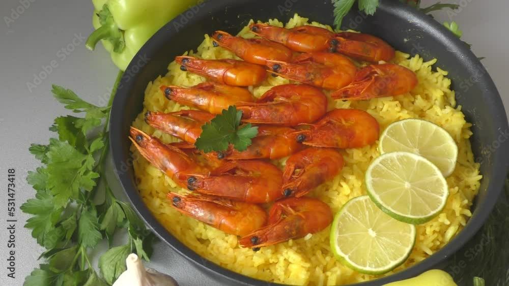 Video „Paella with shrimp is a national Spanish and Valencian dish made
