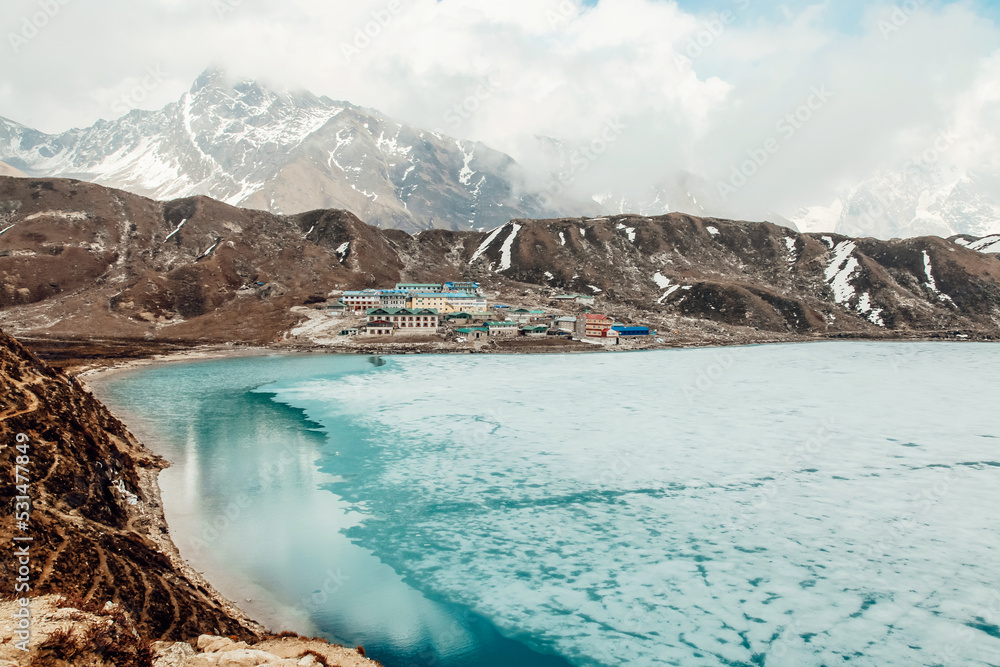 Naklejka premium Amazing blue Gokio lake under ice and snow, Nepal, Himalayas
