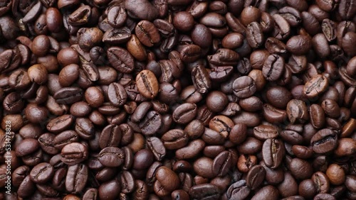Coffee beans close up. Rotation of roasted coffee beans close-up.