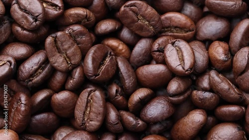 Coffee beans close up. Rotation of roasted coffee beans close-up.