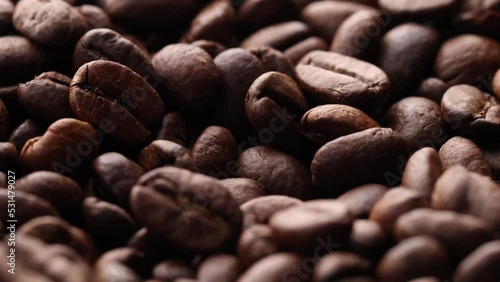 Coffee beans close up. Rotation of roasted coffee beans close-up.