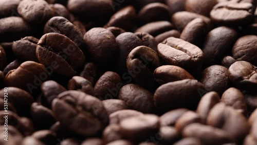 Coffee beans close up. Rotation of roasted coffee beans close-up.