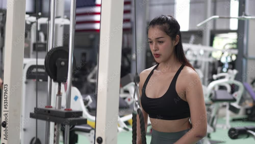 Healthy Asian athlete woman do workout exercise body weight lifting at fitness gym. Healthy Asian athlete woman do workout exercise body weight lifting at fitness gym.