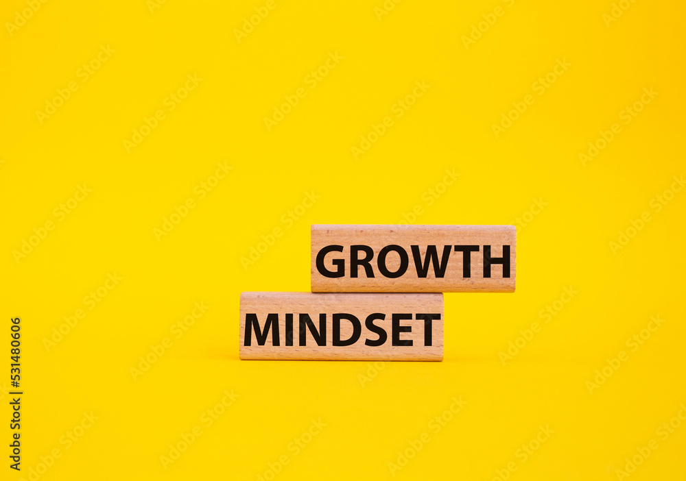 Growth Mindset symbol. Concept word Growth Mindset on wooden blocks. Beautiful yellow background. Business and Growth Mindset concept. Copy space Growth Mindset symbol. Concept word Growth Mindset on wooden blocks. Beautiful yellow background. Business and Growth Mindset concept. Copy space