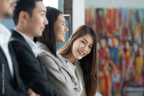 Photography Young asian woman freshman joined the group of young entrepreneurs with three seniors on the team