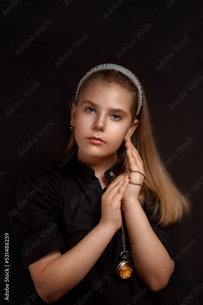girl with a clock on a black background
