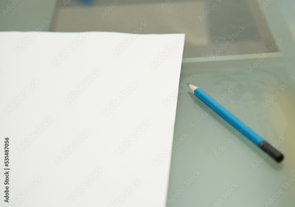 paper and pencil on table paper and pencil on table