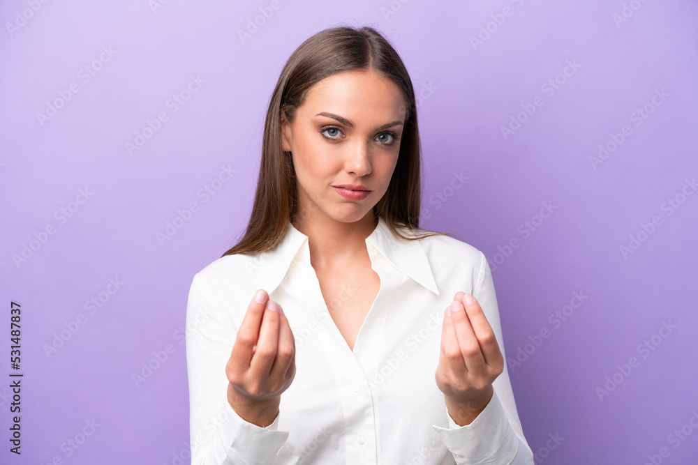 Young caucasian woman isolated on purple background making money gesture but is ruined Young caucasian woman isolated on purple background making money gesture but is ruined