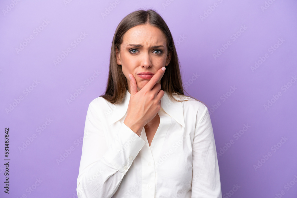 Young caucasian woman isolated on purple background having doubts Young caucasian woman isolated on purple background having doubts