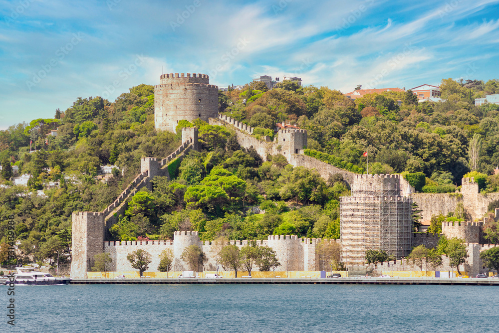 Obraz premium View of ruins of Rumelihisari, Bogazkesen Castle, or Rumelian Castle, in a sunny day, located at the hills of the European side of Bosphorus Strait, Istanbul, Turkey, built by Ottoman Sultan Mehmet II
