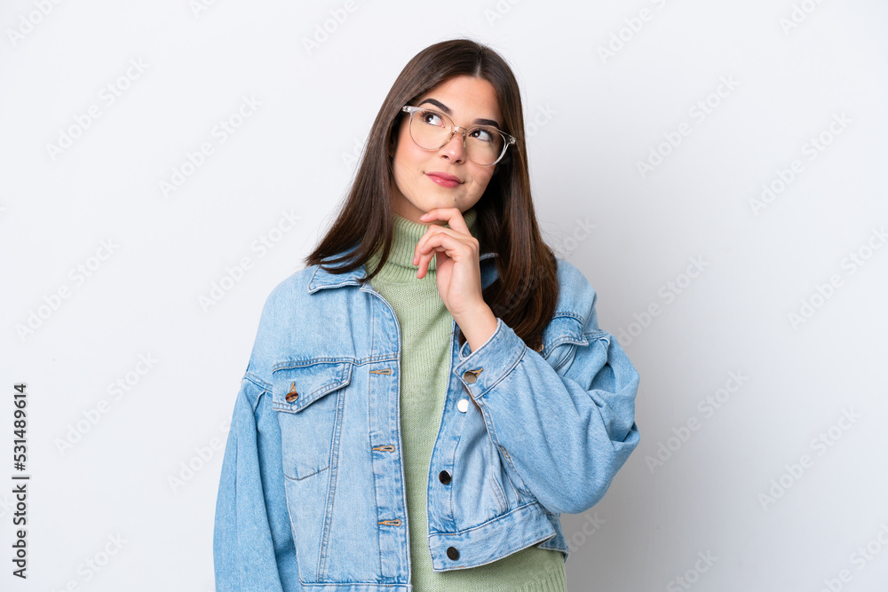 Young Brazilian woman isolated on white background and looking up Young Brazilian woman isolated on white background and looking up