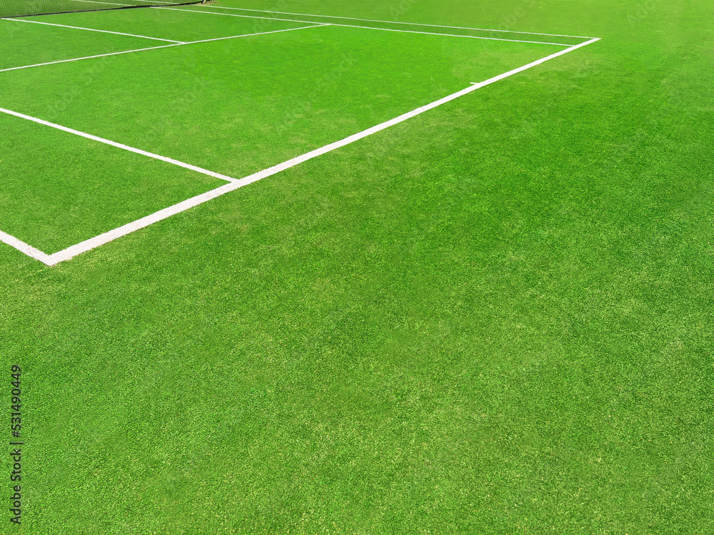 Obraz premium Tennis court with green grass and markings outdoors