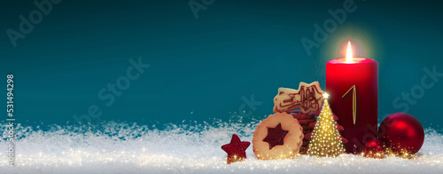 First Advent. Christmas background with Advent candle and decoration.