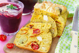 Savoury cake with curry, chorizo, cherry tomatoes, olives and feta