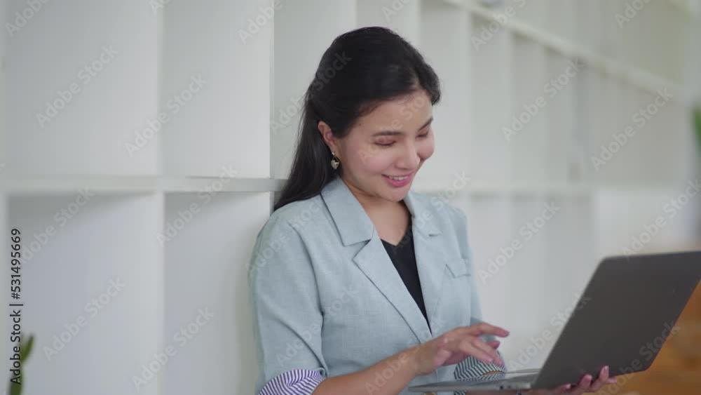 Young business women working and typing on laptop with happy and smile face on office space. Young business women working and typing on laptop with happy and smile face on office space.