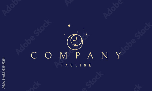 Vector golden logo on which an abstract image of intersecting orbits in space.