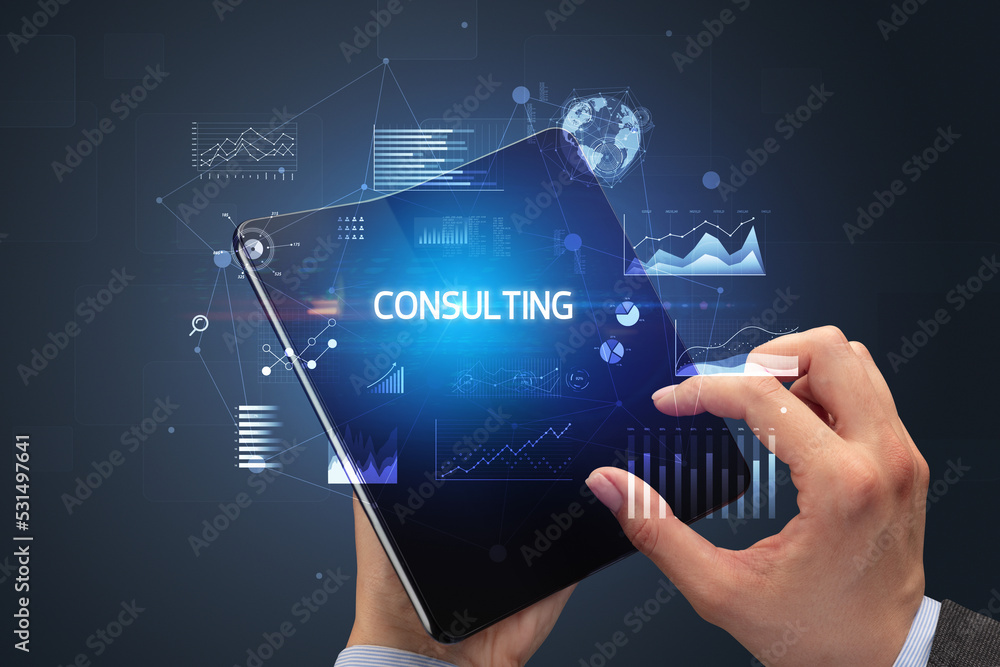 Businessman holding a foldable smartphone, business concept Businessman holding a foldable smartphone, business concept