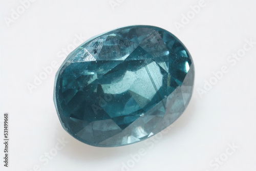 Natural gemstone blue zircon on background photo