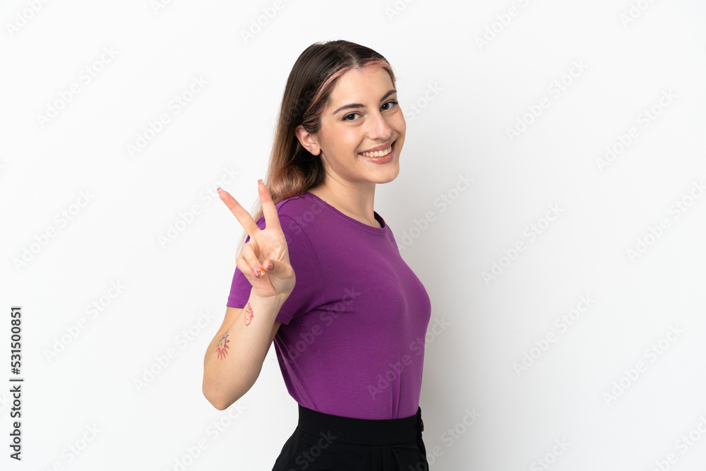 Young caucasian woman isolated on white background smiling and showing victory sign Young caucasian woman isolated on white background smiling and showing victory sign