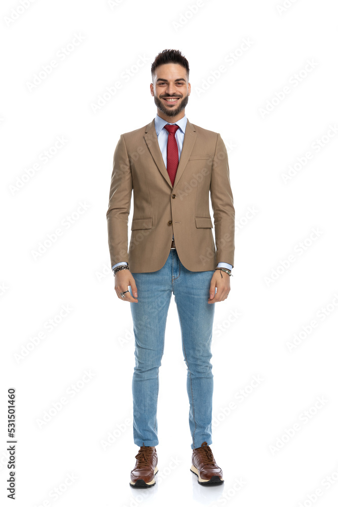 happy smart casual man with red tie standing and smiling happy smart casual man with red tie standing and smiling