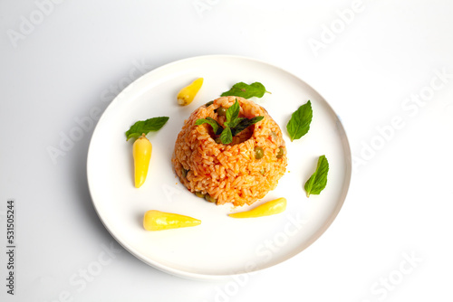 rice pilaf with sauce and ornamental pepper