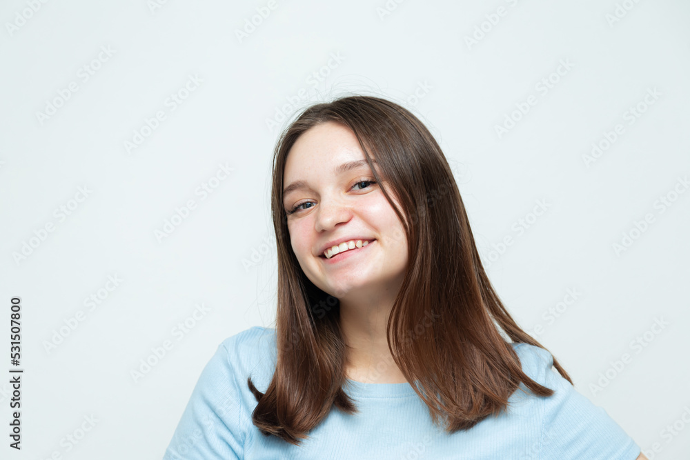 Cheerful caucasian girl posing and looking at the camera. Cheerful caucasian girl posing and looking at the camera.