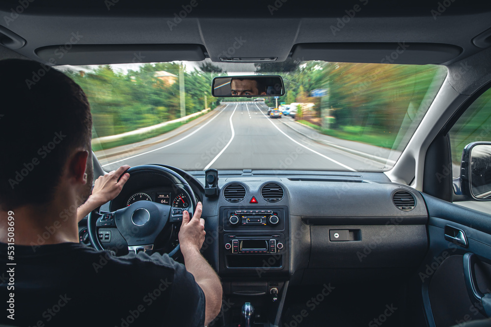 Hands on the wheel when driving at high speed from inside the car.
