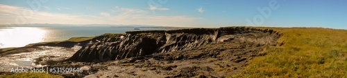 Panorama of melting permafrost photo