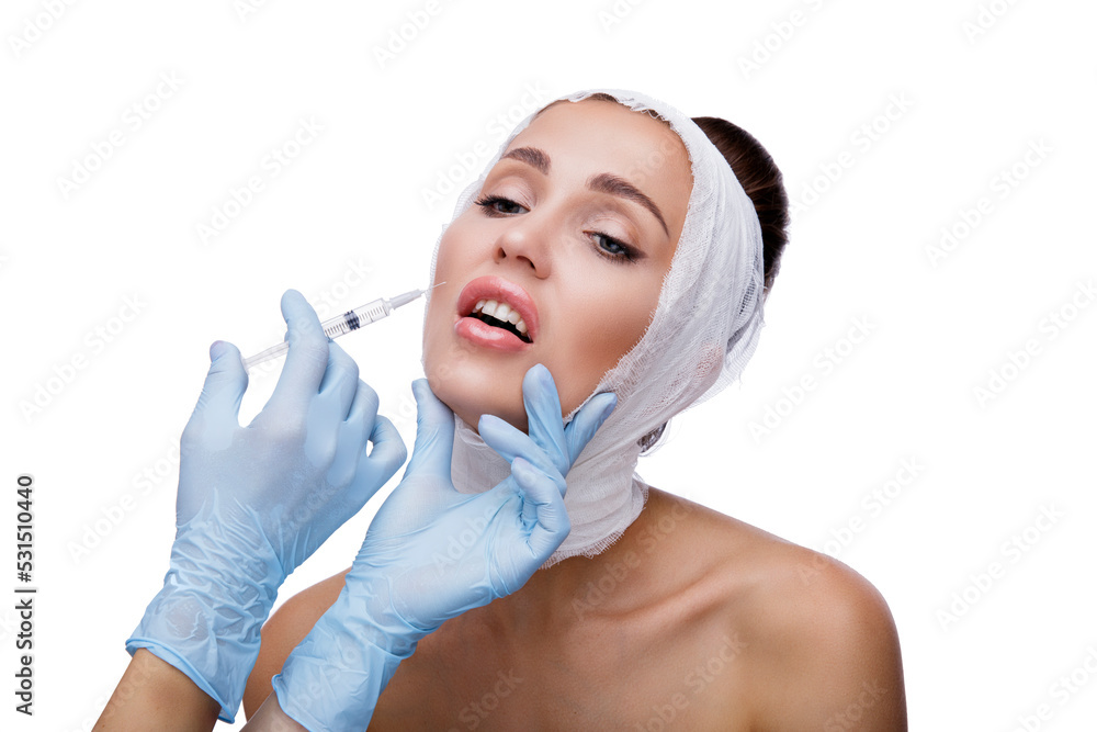 Beautiful woman gets injections. Cosmetology. Beauty Face. Bandages around the face. The model shows fear and discontent Beautiful woman gets injections. Cosmetology. Beauty Face. Bandages around the face. The model shows fear and discontent