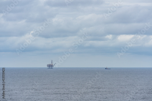 Oil or gas platform and a ship in the sea