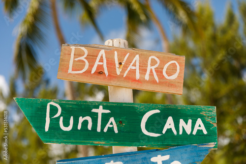 Dominican Republic Bavaro Punta Cana province of La Altagracia. Wooden pole with direction signs photo