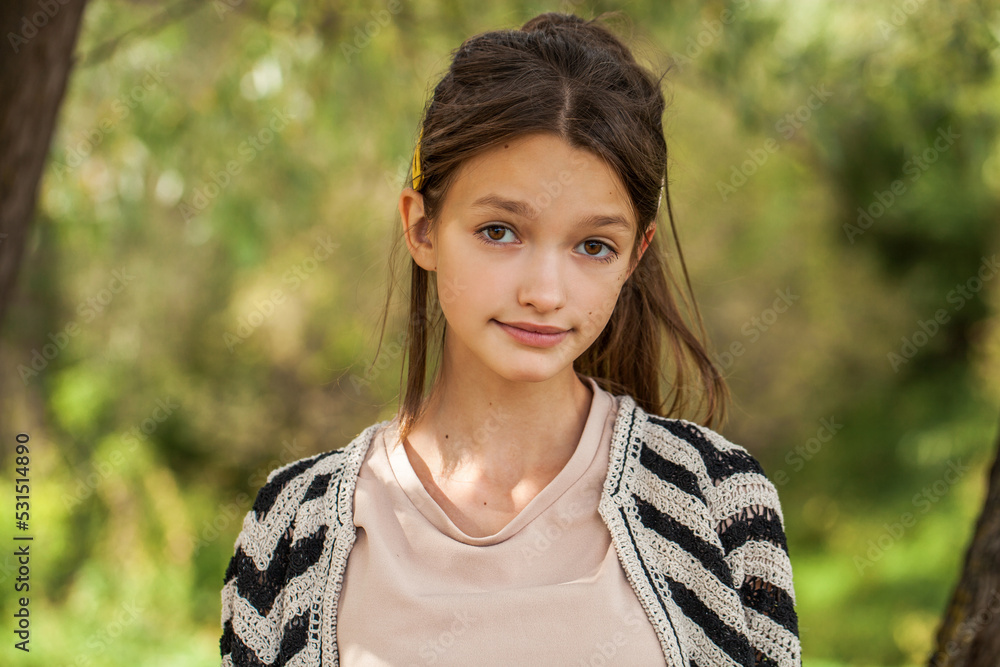 Portrait of a teenage girl, summer park outdoors Portrait of a teenage girl, summer park outdoors