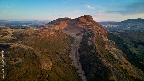 Arthur's Seat from above at summer evening - flying drone over Edinburgh