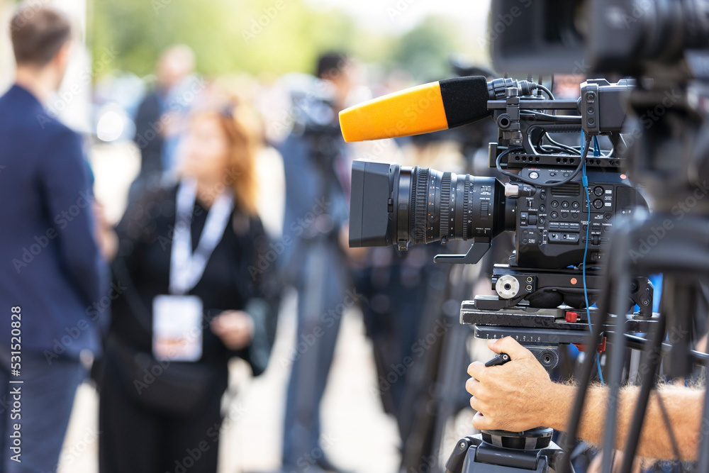 News conference or media interview. Shooting press event with a television camera. News conference or media interview. Shooting press event with a television camera.