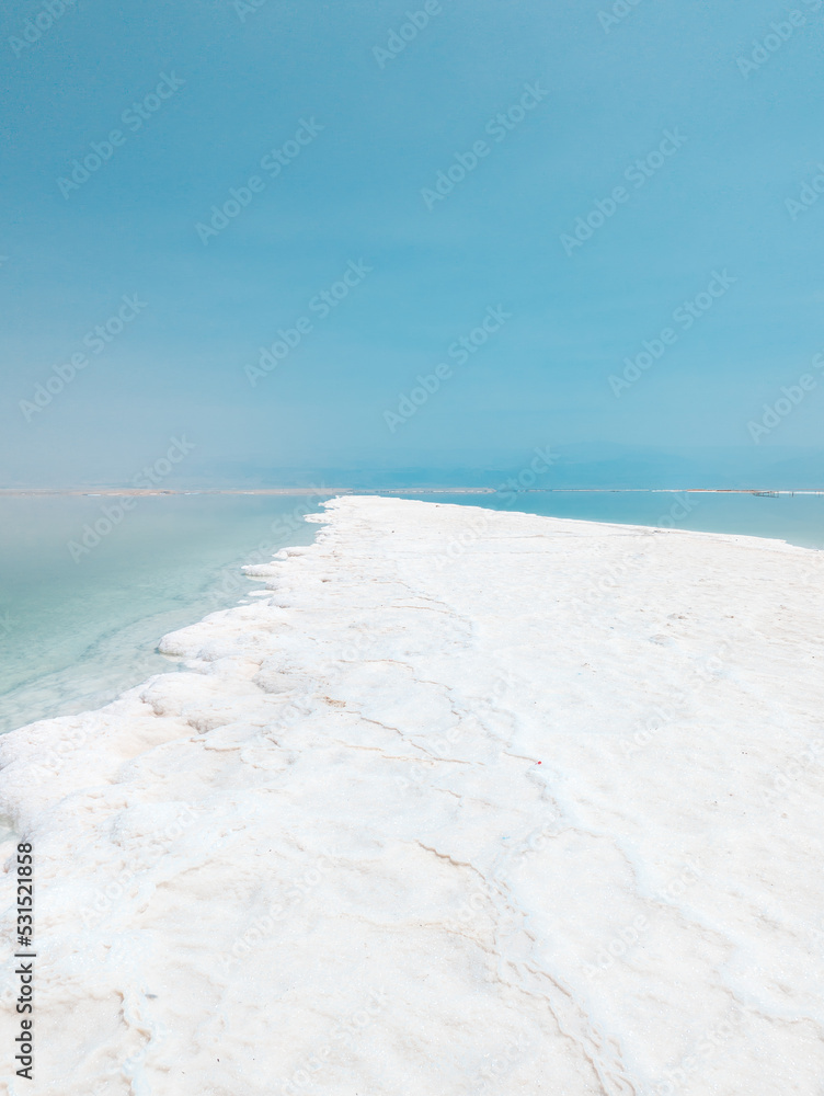 Landscape view on Dead Sea salt crystals formations, clear cyan green water at Ein Bokek beach, Israel Landscape view on Dead Sea salt crystals formations, clear cyan green water at Ein Bokek beach, Israel