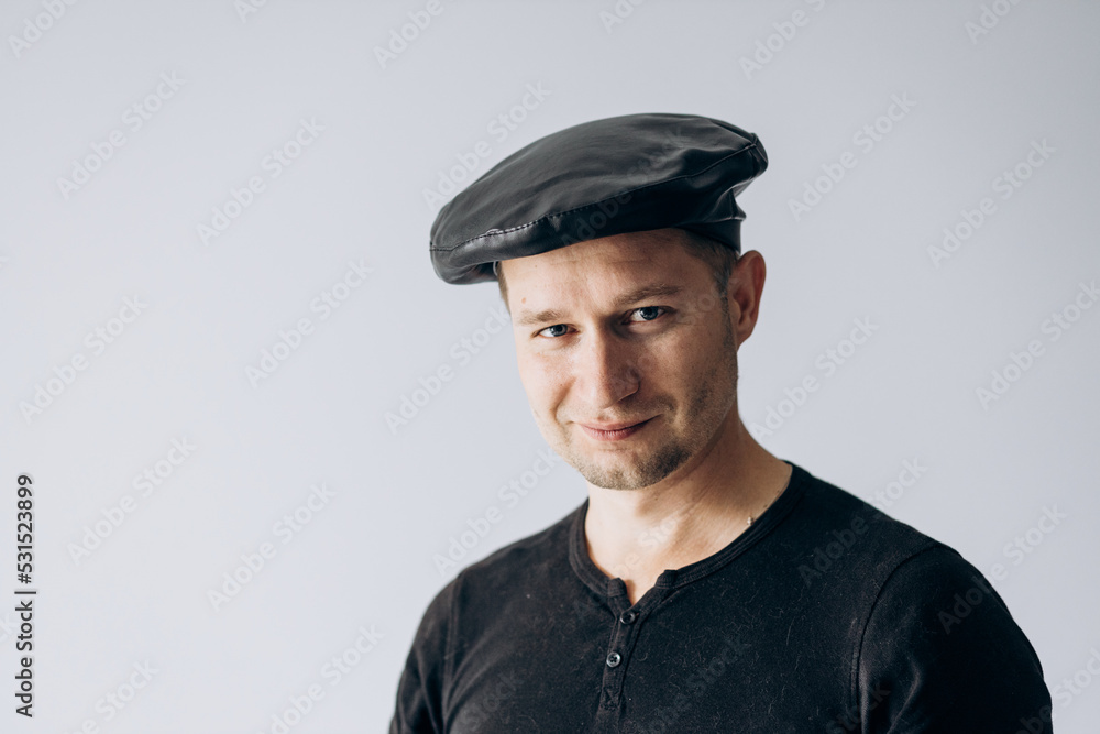 World France day, french guy in black t-shirt and beret stands and looks at camera. World France day, french guy in black t-shirt and beret stands and looks at camera.