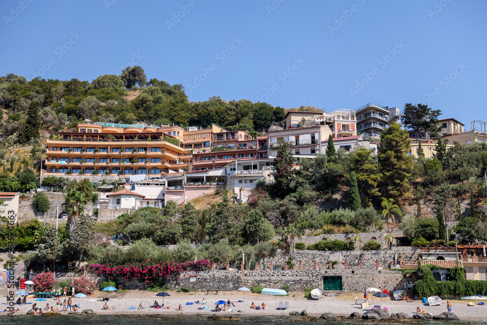 Taormina, Italy - July 22, 2022: The rocky seaside and coastline below Taormina in Sicily
