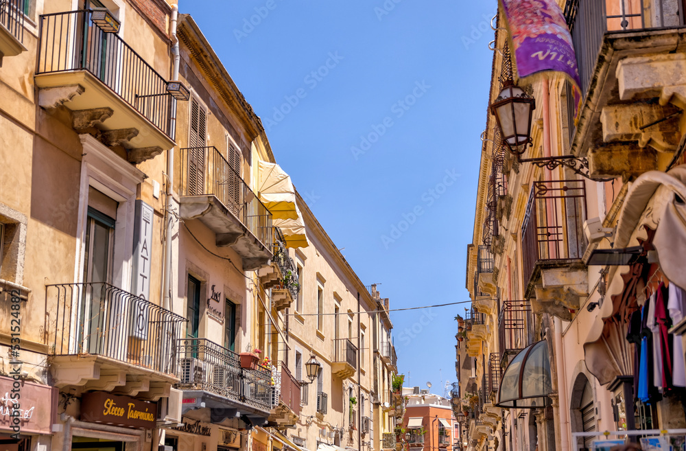 Fototapeta premium Taormina, Italy - July 22, 2022: Scenic streets and sidewalks in Taormina, Sicily 