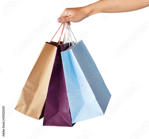 Hand holding paper shopping bags. Image isolated on white background. Sale, shopping concept