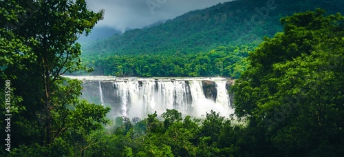 Quadro su tela Waterfall in the forest. An image from Athirapally, India.