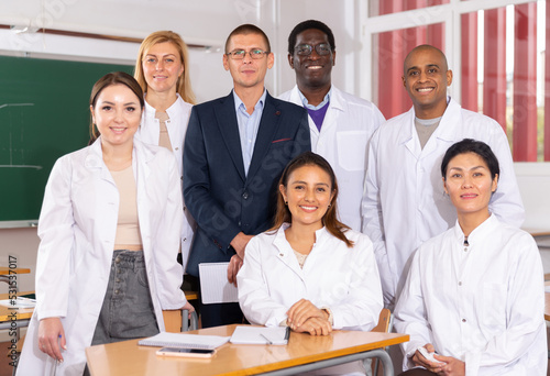 Fotografie Portrait of multi-ethnic group of adult medical students with coach in classroom