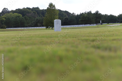 National Cemetery, with markers, head stones , and flags